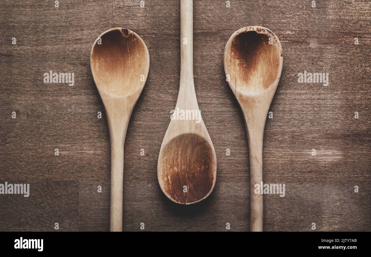 Wooden kitchen spoons on table top Stock Photo