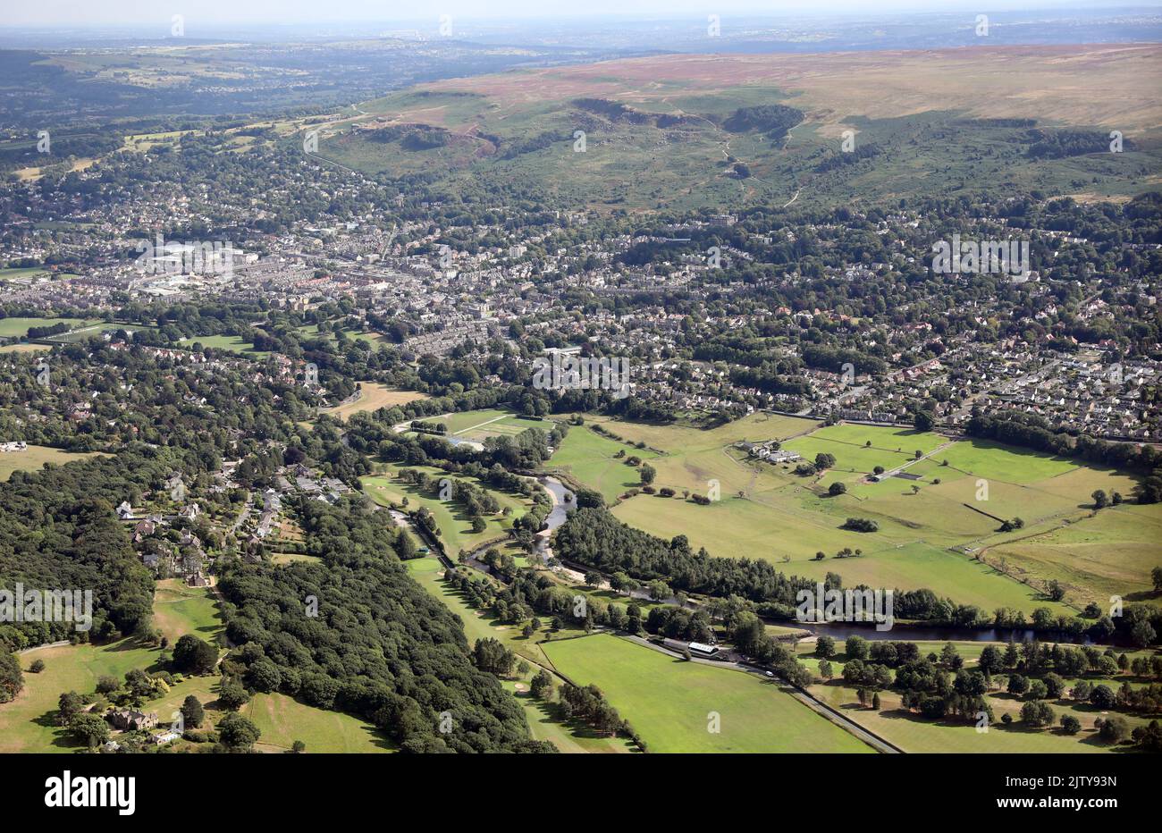 aerial view of the Yorkshire town of Ilkley, with the River Wharfe in the foreground, town centre then Ilkley Moor in the backgorund Stock Photo