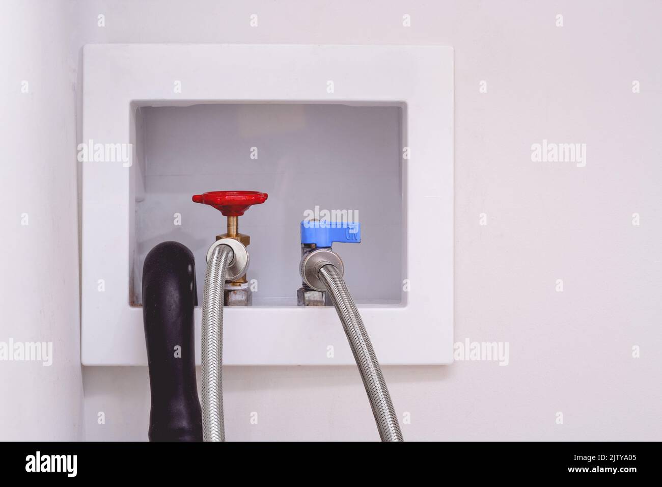 Washing machine hoses including drain and hot and cold outlets Stock