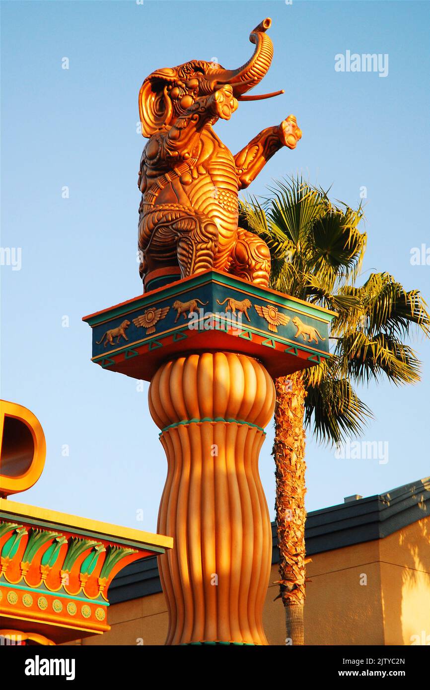 An elephant, similar to the ones ween in old D W Griffith movies, stands in a replica of Hollywood movie set Stock Photo