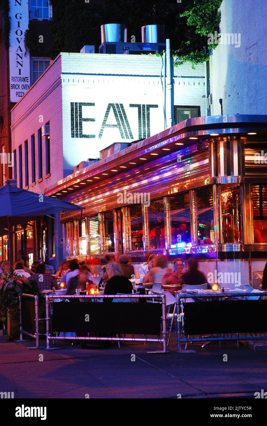 People enjoy an alfresco meal at the Empire Diner, a classic restaurant in the West Village of Manhattan, New York City Stock Photo