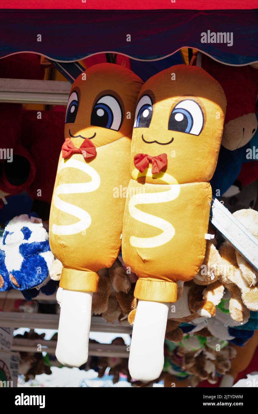 Two giant stuffed corndogs, prizes at a game booth at the Minnesota