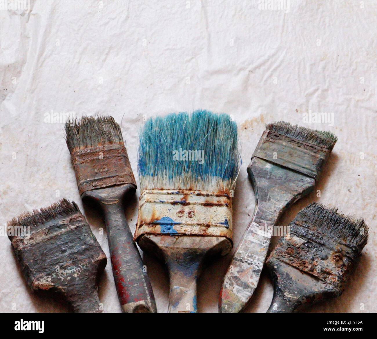 Old rusty paint brushes. Used different sizes of paint brushes Stock