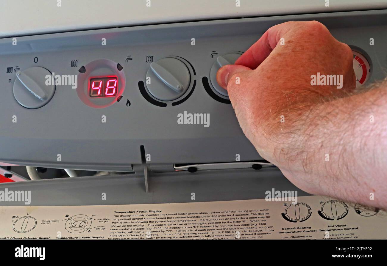 Manually changing hot water temp-Reducing fuel bill, lowering Condensing Central Heating boiler temperature for hot water - Baxi Platinum Stock Photo