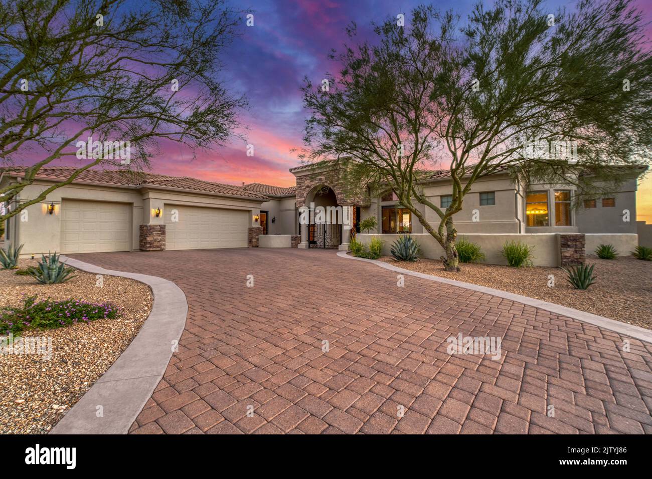 A luxury home at sunset Stock Photo - Alamy