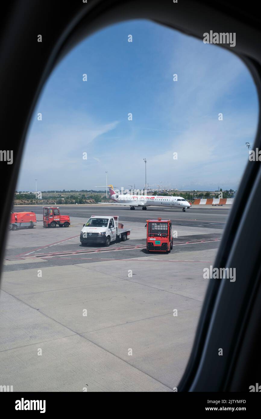 Looking through the window from inside the cabin whilst traveling by plane from Madrid to granada, on a CRJ1000 Bombardier aircraft, Spain Stock Photo