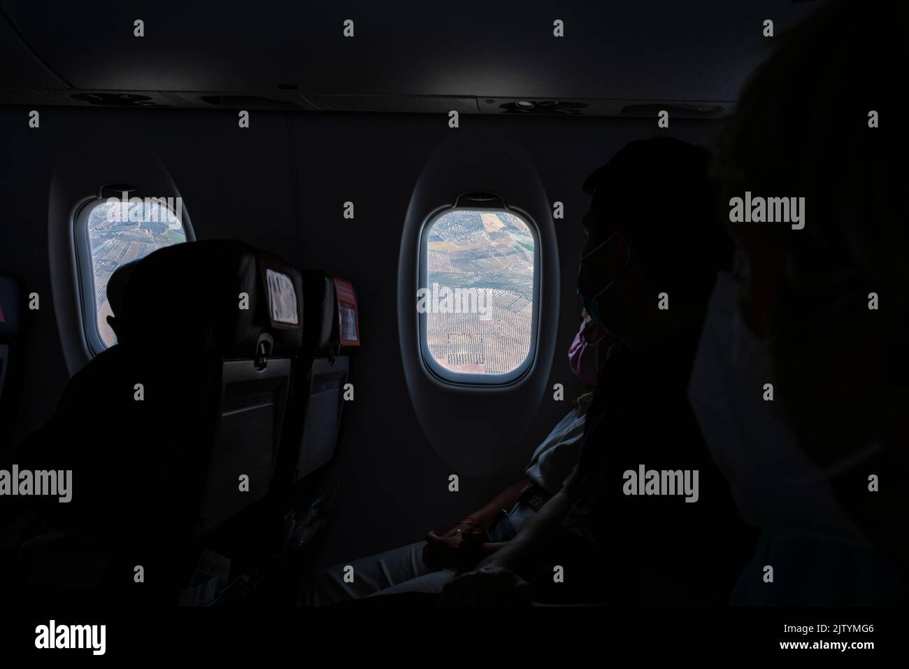 Looking through the window from inside the cabin whilst traveling by plane from Madrid to granada, on a CRJ1000 Bombardier aircraft, Spain Stock Photo
