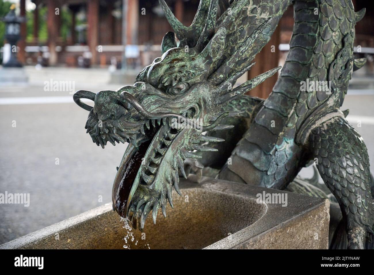 A closeup shot of a dragon faucet in Higashi Hongan-ji Temple in Kyoto, Japan Stock Photo