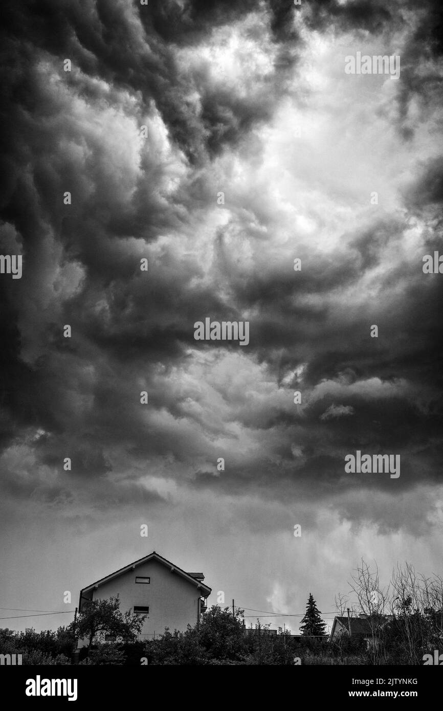 Dramatic stormy clouds sky over Black and White Stock Photos & Images ...