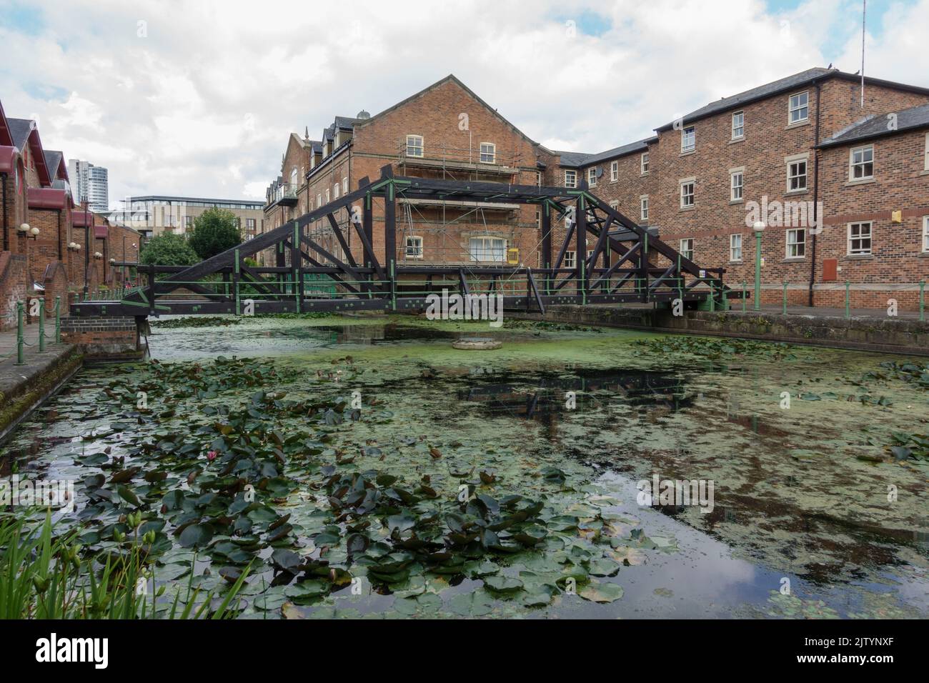 Walkway across redeveloped riverside dock, Navigation Walk on the River Aire, Leeds, West Yorkshire, UK. Stock Photo