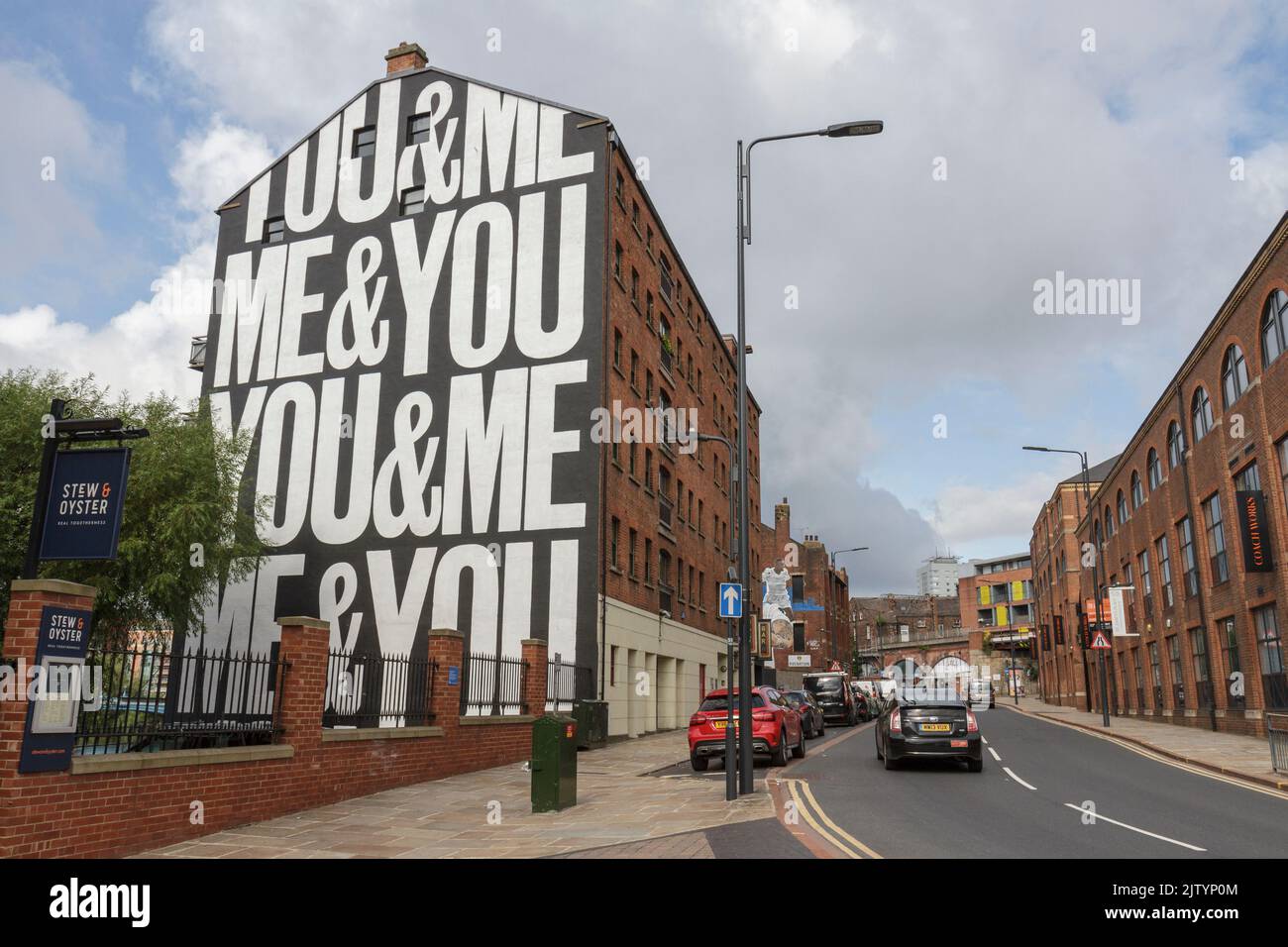 Murals on the sides of former warehouses in the Calls Landing area of Leeds, West Yorkshire, UK. Stock Photo