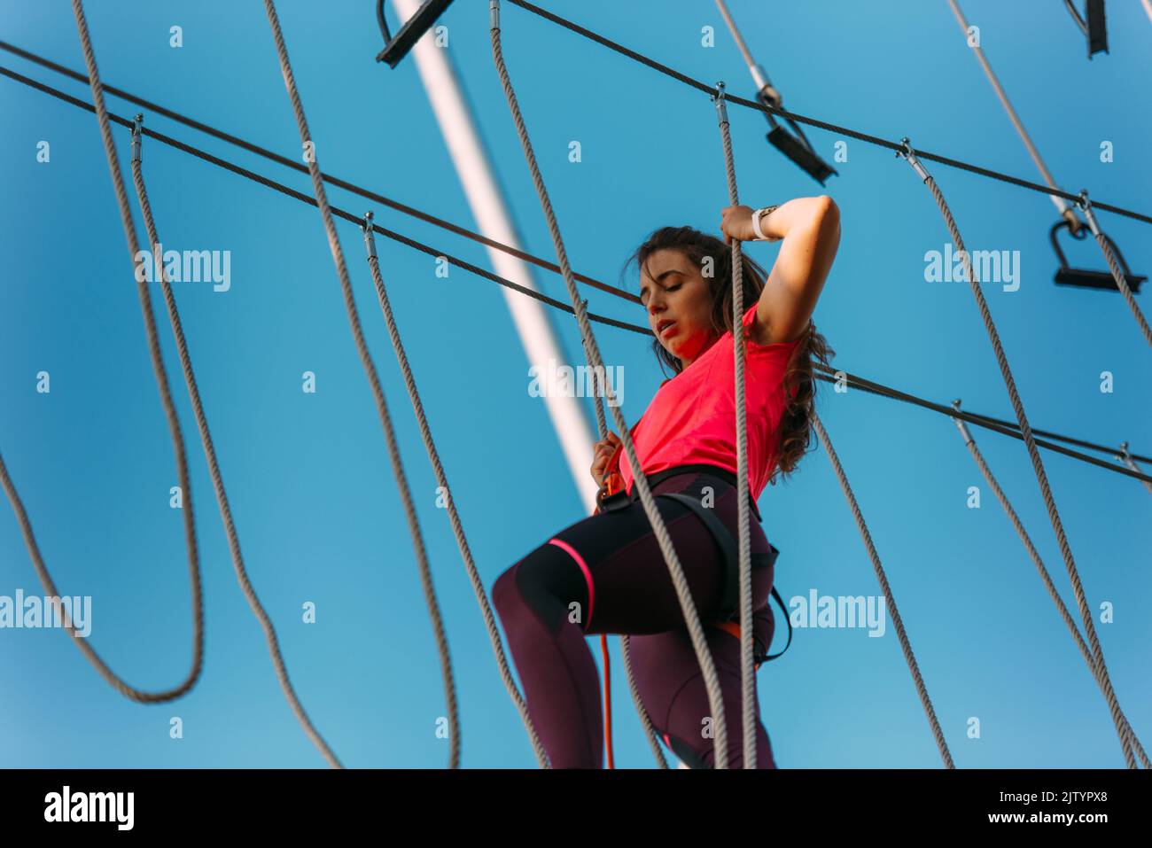 Girl On High Ropes Aerial extreme high ropes adventure courses hi-res stock photography ...