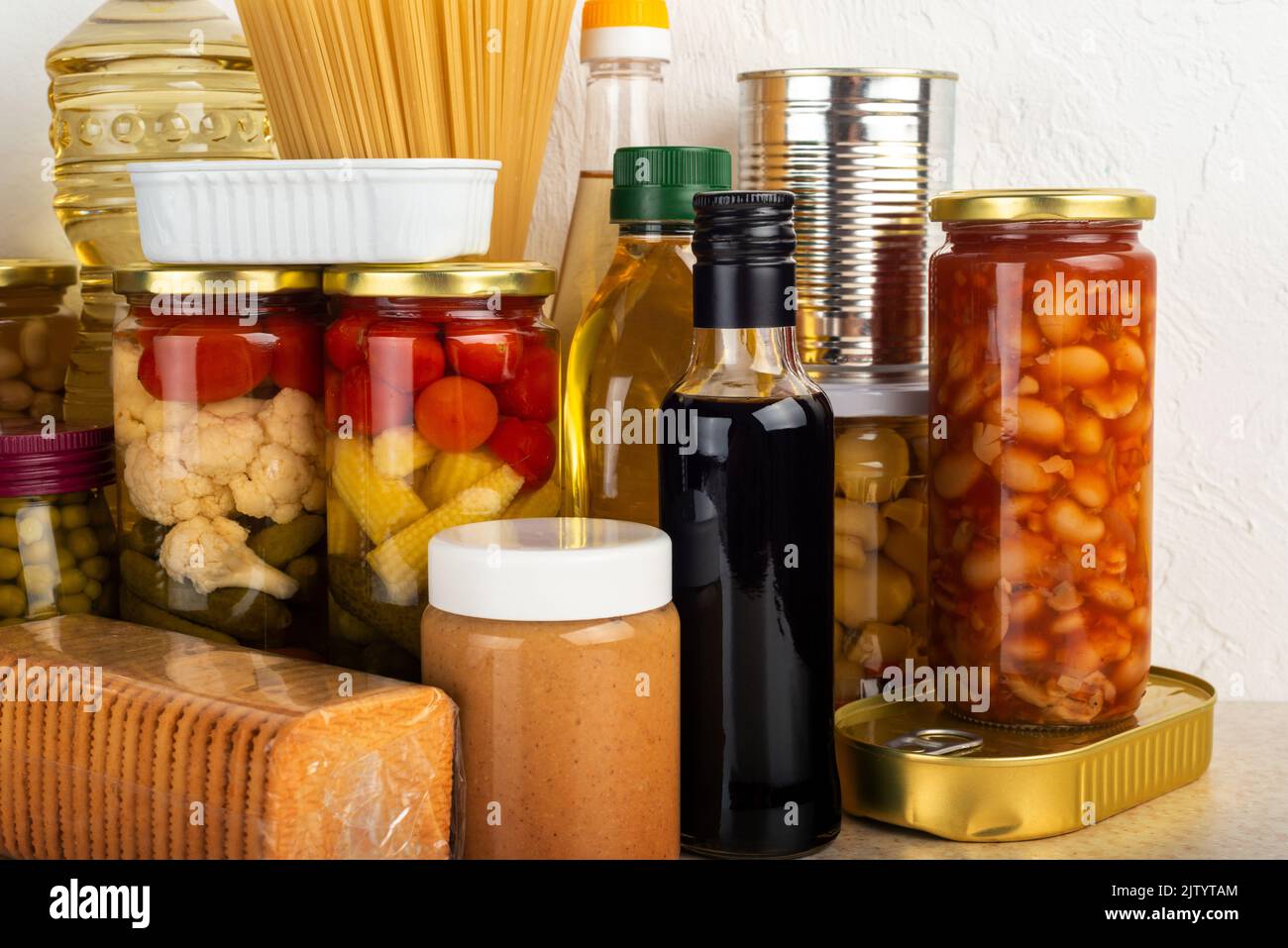 Emergency survival food set on white kitchen table Stock Photo