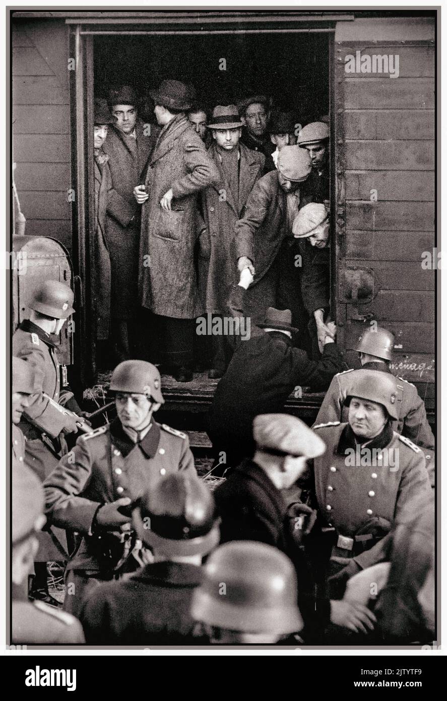 WW2 1943 Deportation of Jewish men from Marseilles Old Port Gare d'Arenc France. Under the collaboration of Vichy & Nazi regime of  occupied France, energetically assisted by the Vichy French Police. Ordered directly by Himmler. Südfrankreich, Marseille, Güterbahnhof Gare d'Arenc.- Deportation von Juden unter Bewachung des SS-Polizeiregiments Griese und französischer Polizei. Vichy France Stock Photo
