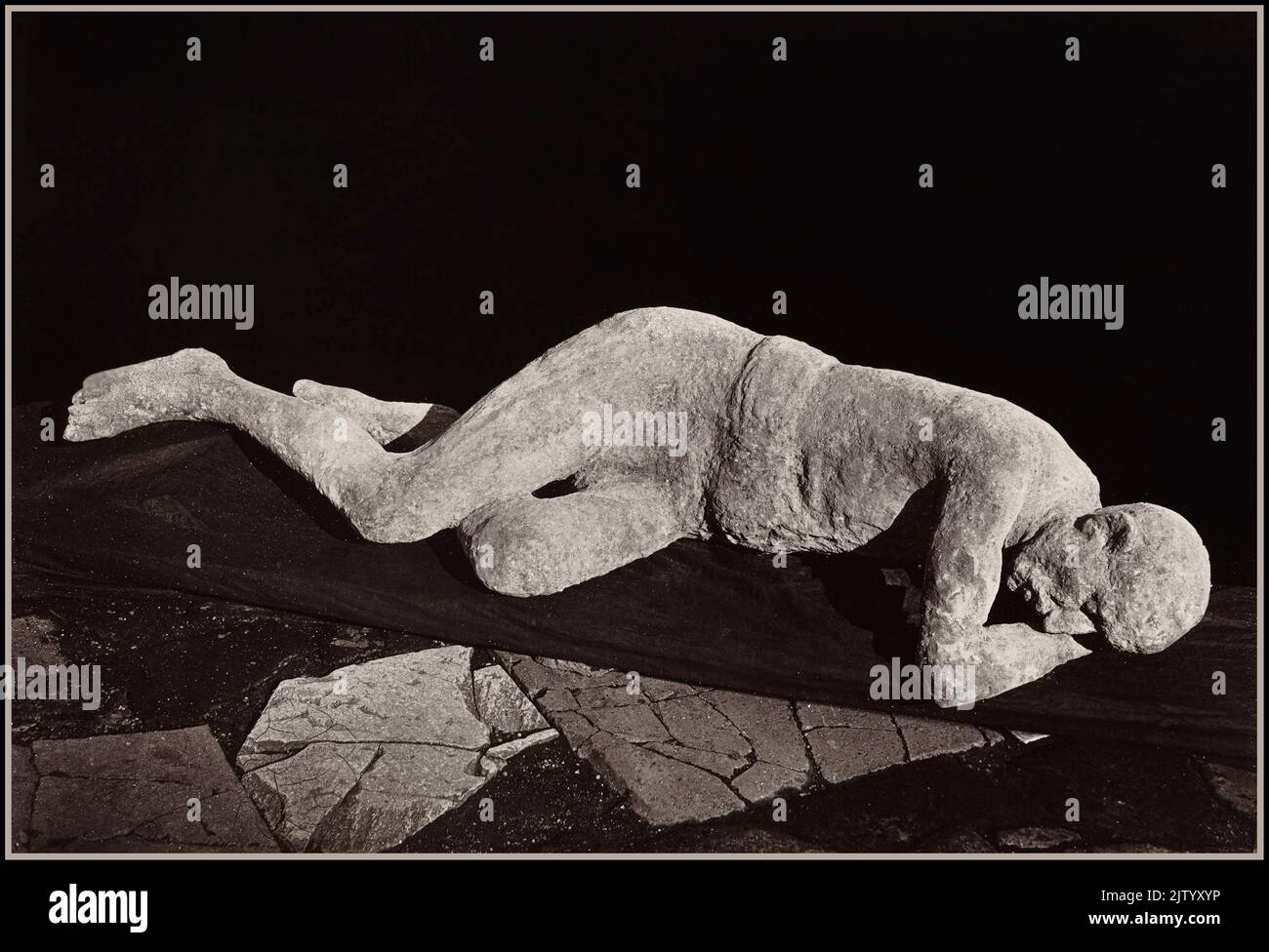 VESUVIUS BODY POMPEII Petrified body cast in ash, a poignant victim of the eruption of Mt Vesuvius volcano in Pompeii, Italy 'Giorgio Sommer, Impronte umane 'Human Footprints' (Pompeii), 1873, albumen print image: Stock Photo