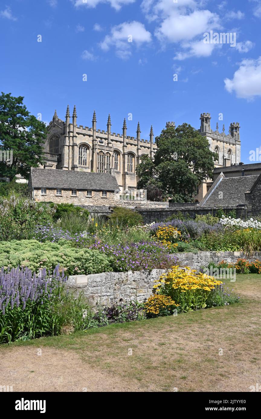 Christ Church War Memorial Garden in flower during the summer months with the cathedral in the background Stock Photo