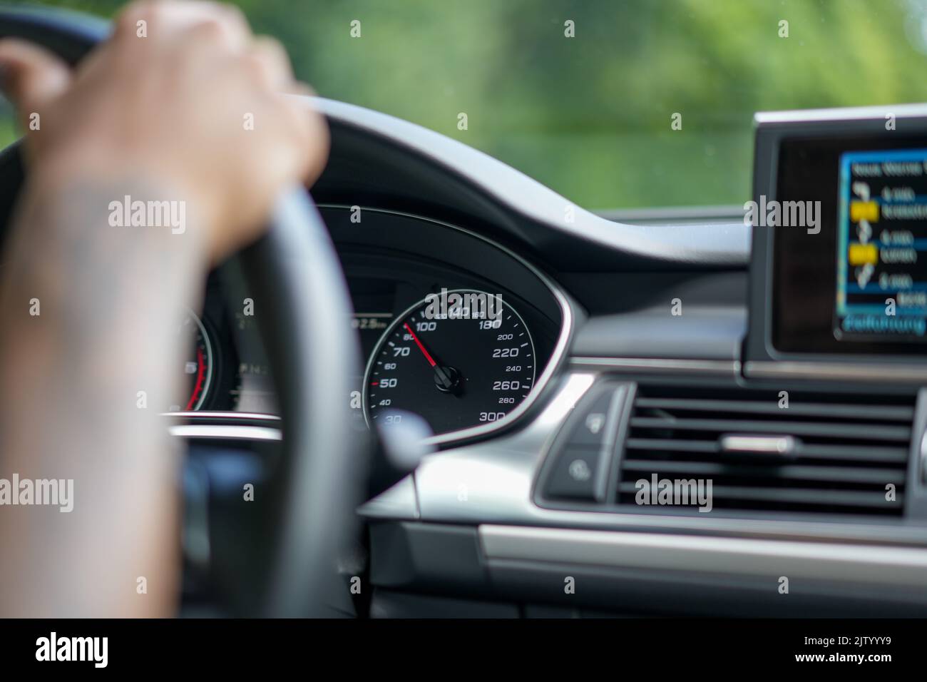 The hand holding the car steering wheel while driving with car ...