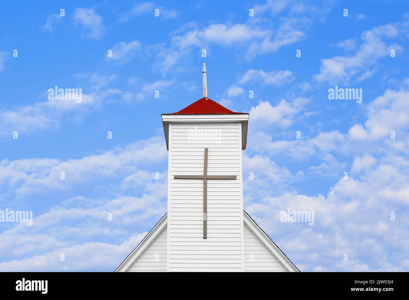 Christian church steeple and blue sky with copy space Stock Photo
