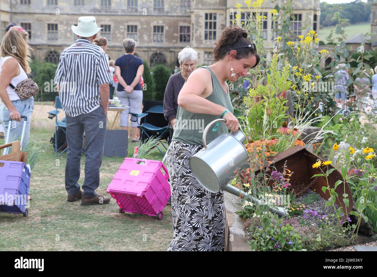 The first ever BBC Gardeners' World Autumn Fair is taking place at Audley End House in Essex. Shona Lockheart watering her small space garden 'We're all Cuckoo here.' Stock Photo