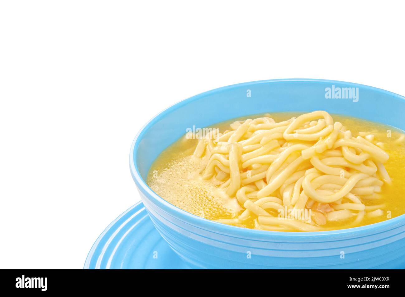 Chicken noodle soup in blue bowl with copy space Stock Photo