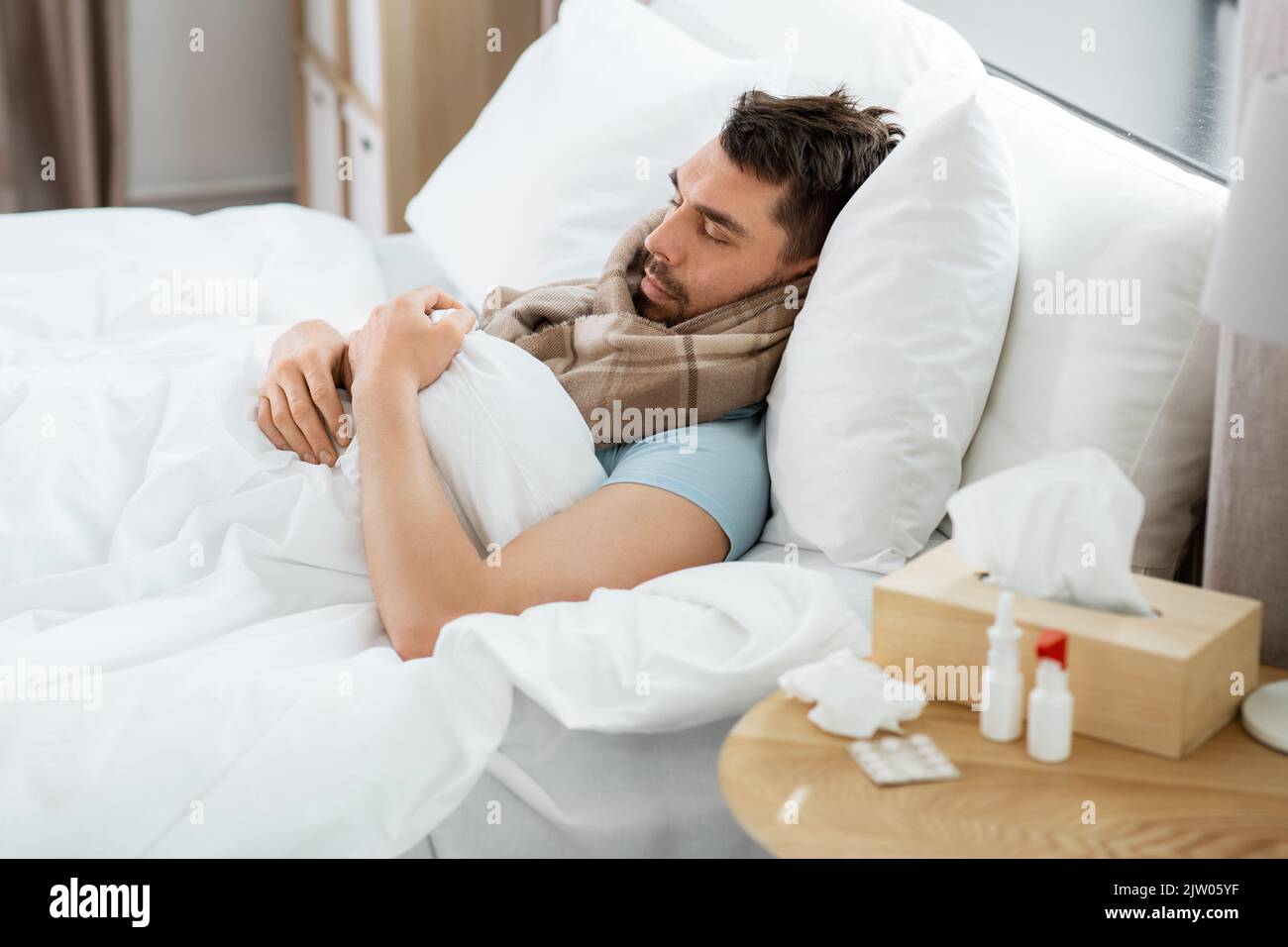 sick man sleeping in bed at home Stock Photo Alamy