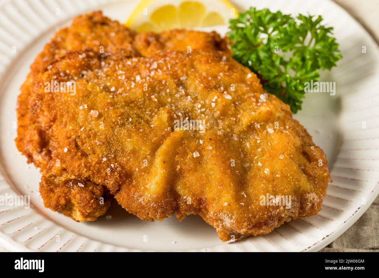 Homemade Deep Fried German Pork Schnitzel with Salt and Lemon Stock