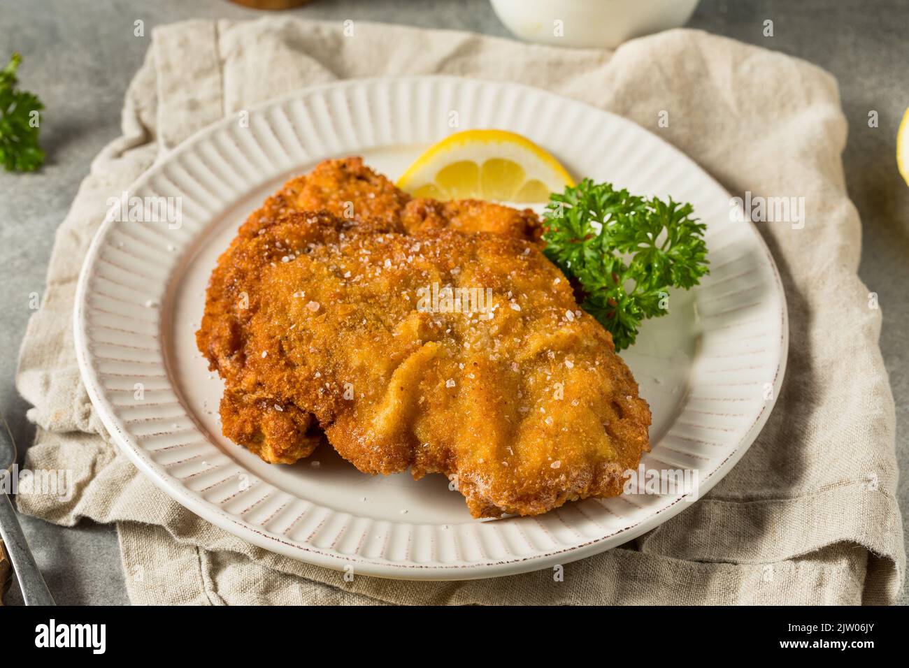 Homemade Deep Fried German Pork Schnitzel with Salt and Lemon Stock