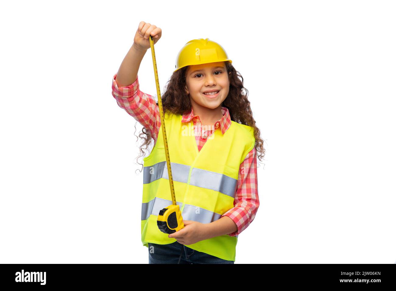 little girl in construction helmet with ruler Stock Photo Alamy
