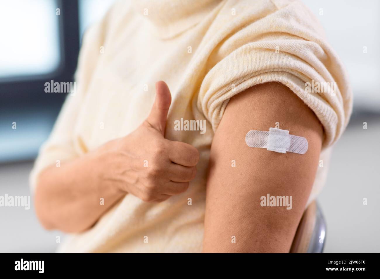 Band aid on woman arm hires stock photography and images Alamy