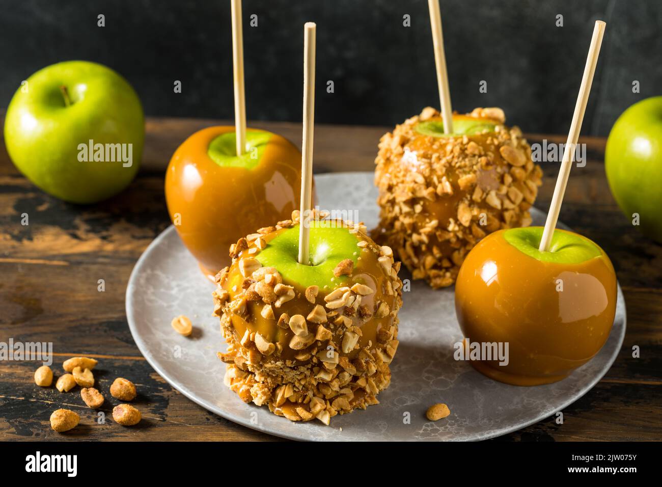 Homemade Halloween Candy Taffy Apples with Caramel and Peanuts Stock