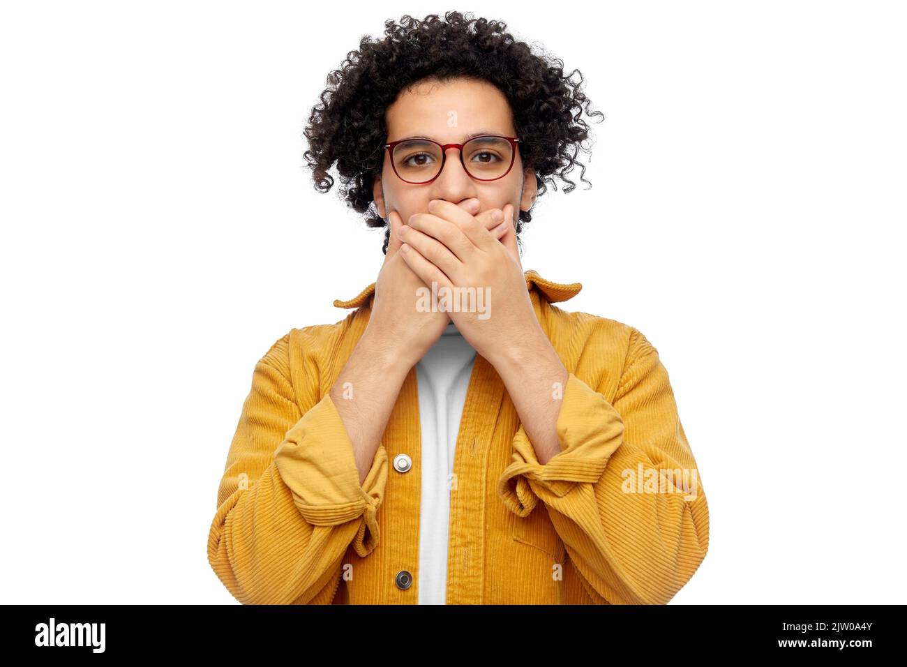 man in glasses and jacket covering mouth by hands Stock Photo