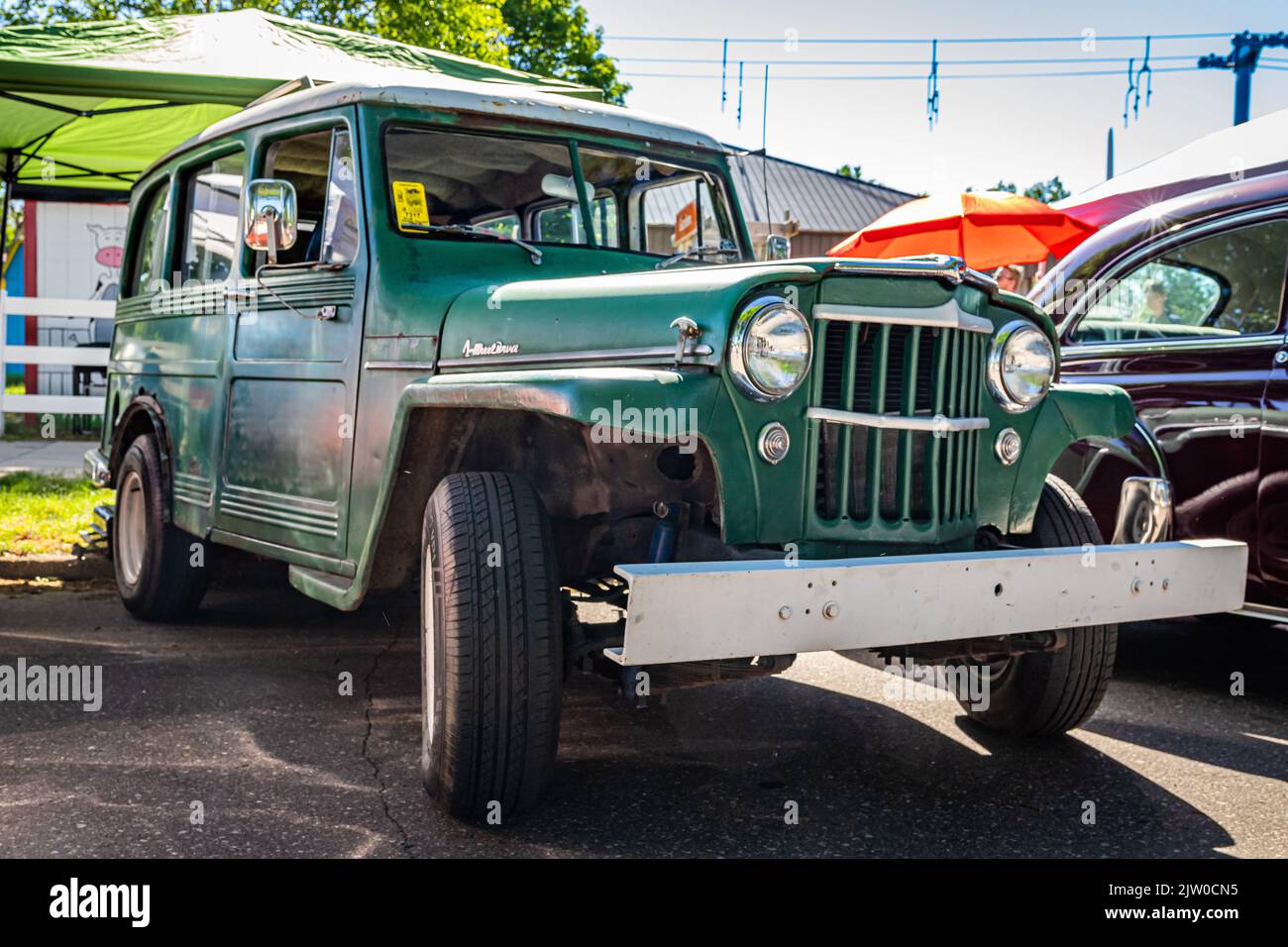 Falcon Heights, MN - June 17, 2022: Low perspective front corner view of a 1954 Willys Overland Station Wagon at a local car show. Stock Photo