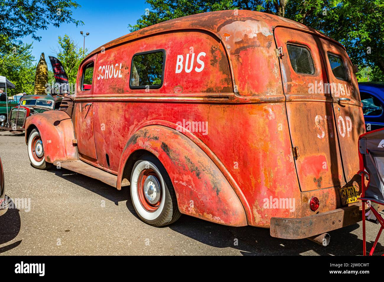 Falcon Heights, MN - June 17, 2022: Low perspective rear corner view of a 1947 Ford Panel Delivery Truck School Bus at a local car show. Stock Photo
