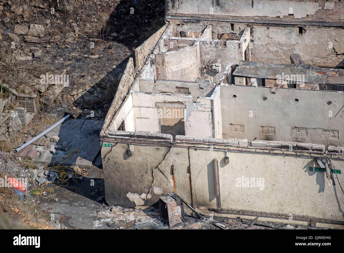 Swansea, UK. 02nd Sep, 2022. Workers clearing up in the remains of the former Cinderella's nightclub today alongside the lighthouse and Pier in the small village of Mumbles, Swansea, UK. The former nightclub was destroyed by a large fire earlier this week Credit: Phil Rees/Alamy Live News Stock Photo