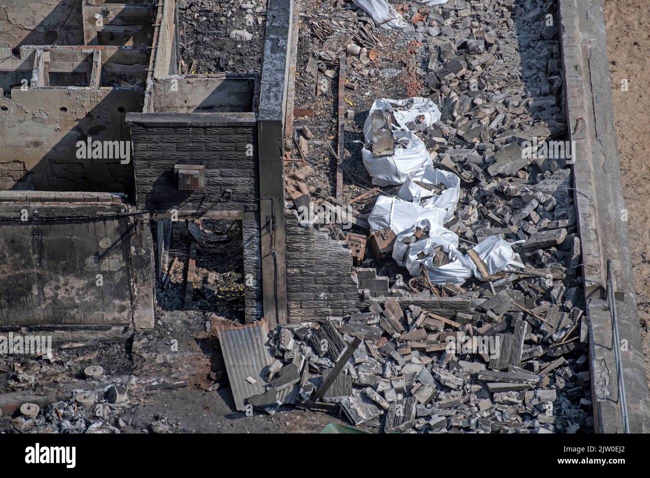 Swansea, UK. 02nd Sep, 2022. Workers clearing up in the remains of the former Cinderella's nightclub today alongside the lighthouse and Pier in the small village of Mumbles, Swansea, UK. The former nightclub was destroyed by a large fire earlier this week Credit: Phil Rees/Alamy Live News Stock Photo