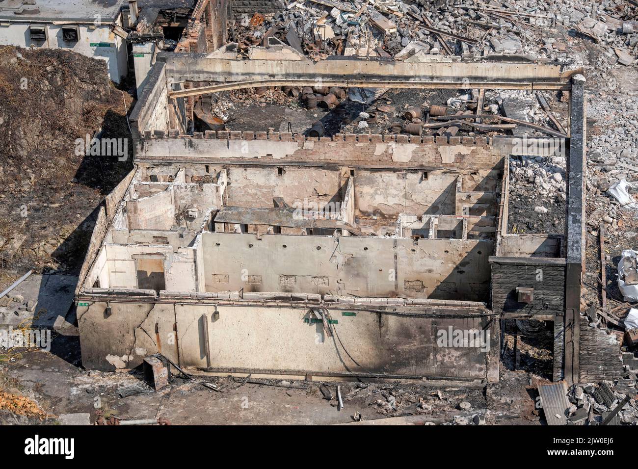 Swansea, UK. 02nd Sep, 2022. Workers clearing up in the remains of the former Cinderella's nightclub today alongside the lighthouse and Pier in the small village of Mumbles, Swansea, UK. The former nightclub was destroyed by a large fire earlier this week Credit: Phil Rees/Alamy Live News Stock Photo