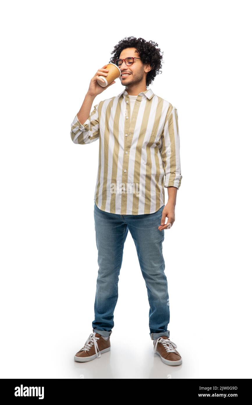 smiling young man with takeaway coffee cup Stock Photo