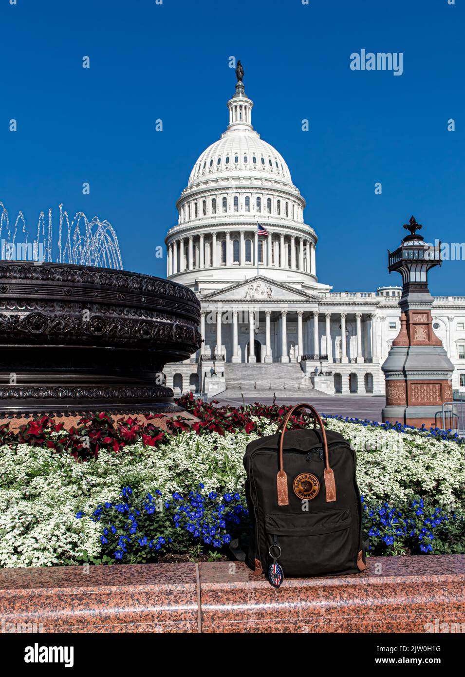Swedish Fjällräven kånken backpack in front of a view of the Capitol building on Capitol Hill, District of Colombia, Washington D.C. Stock Photo