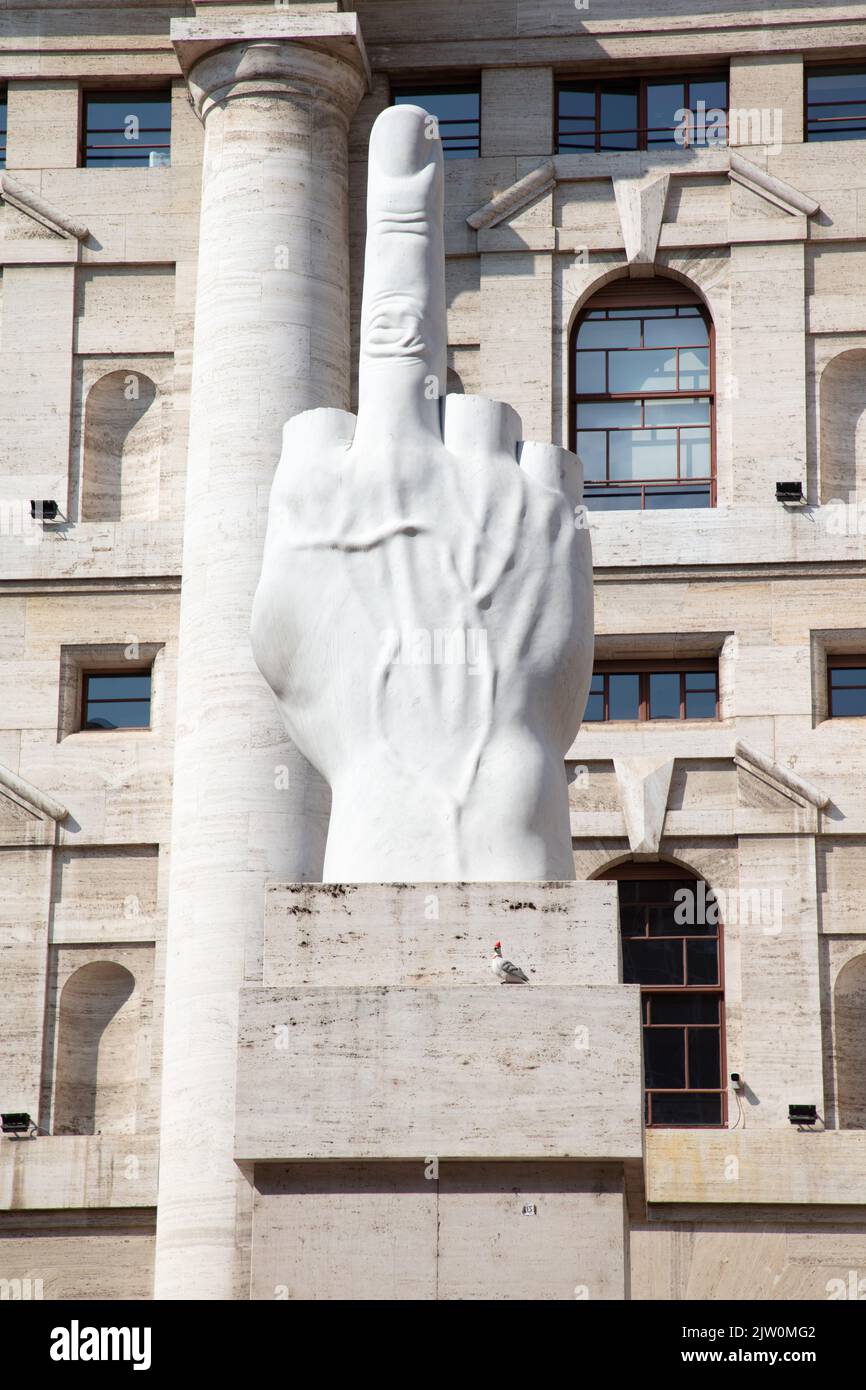 L.O.V.E. Sculpture by Maurizio Cattelan in front of the Milan stock exchange, Milan, Italy Stock Photo