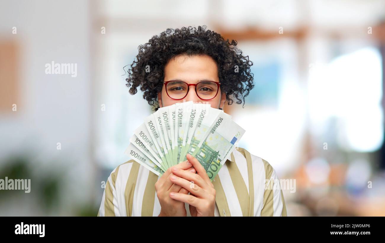 happy man with euro money at office Stock Photo - Alamy