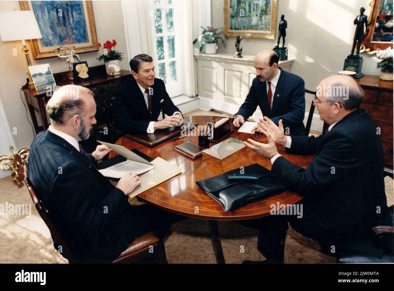 United States President Ronald Reagan and General Secretary of the Communist Party of the Soviet Union Mikhail Sergeyevich Gorbachev meet in the Oval Office study during the morning of Wednesday, December 9, 1987.  The U.S. and U.S.S.R. interpreters attended the meeting..Mandatory Credit: Bill Fitz-Patrick - White House via CNP /MediaPunch Stock Photo