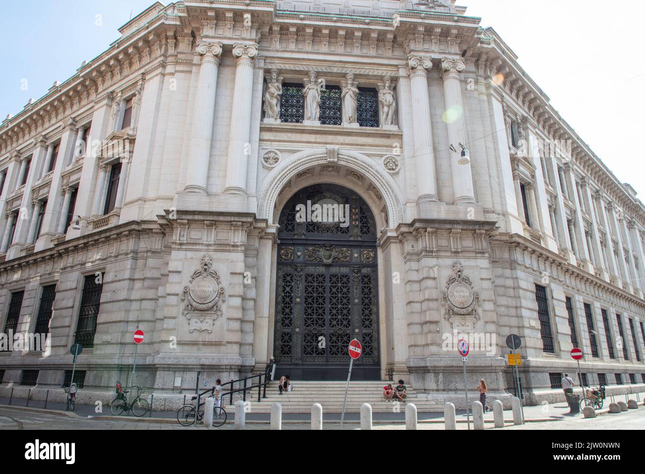 Main entrance of the Bank of Italy building with an enormous iron and bronze gate and beautifully decorated facade, Milan, Italy Stock Photo
