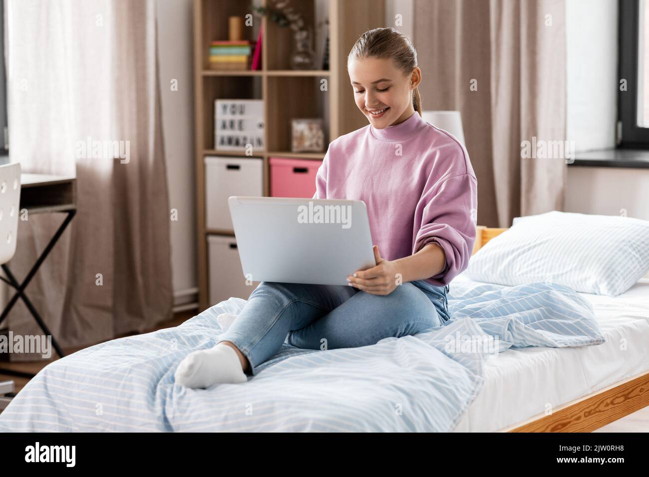 student girl with laptop computer learning at home Stock Photo - Alamy