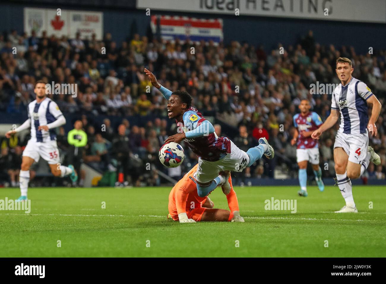 Dave Button #1 of West Bromwich Albion  fouls Nathan Tella #23 of Burnley during the Sky Bet Championship match West Bromwich Albion vs Burnley at The Hawthorns, West Bromwich, United Kingdom, 2nd September 2022  (Photo by Gareth Evans/News Images) Stock Photo
