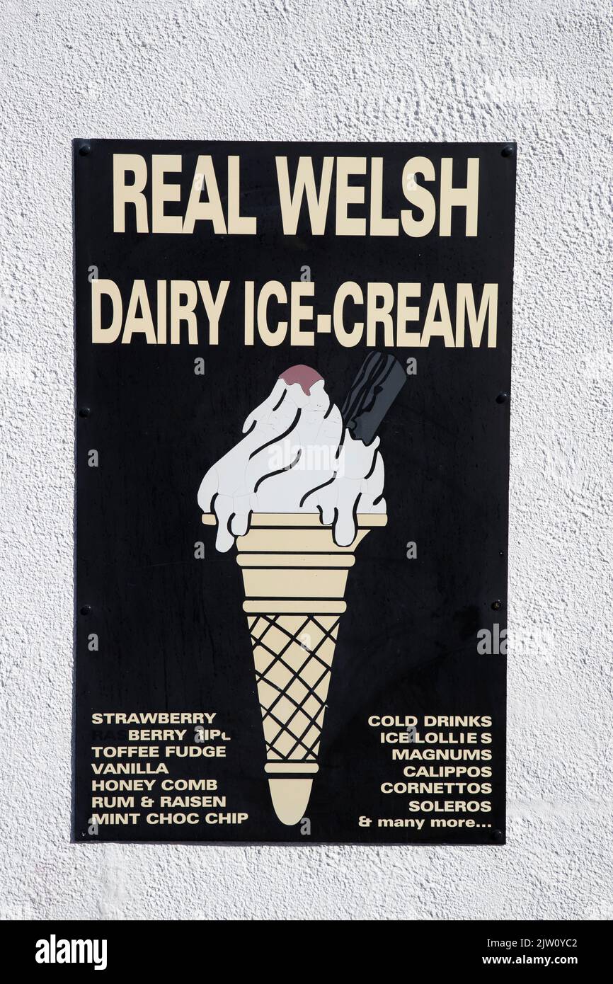 A sign advertising Real Welsh Ice Cream on a café adjacent to Conwy Castle in Conwy Town, North Wales, U.K. Stock Photo