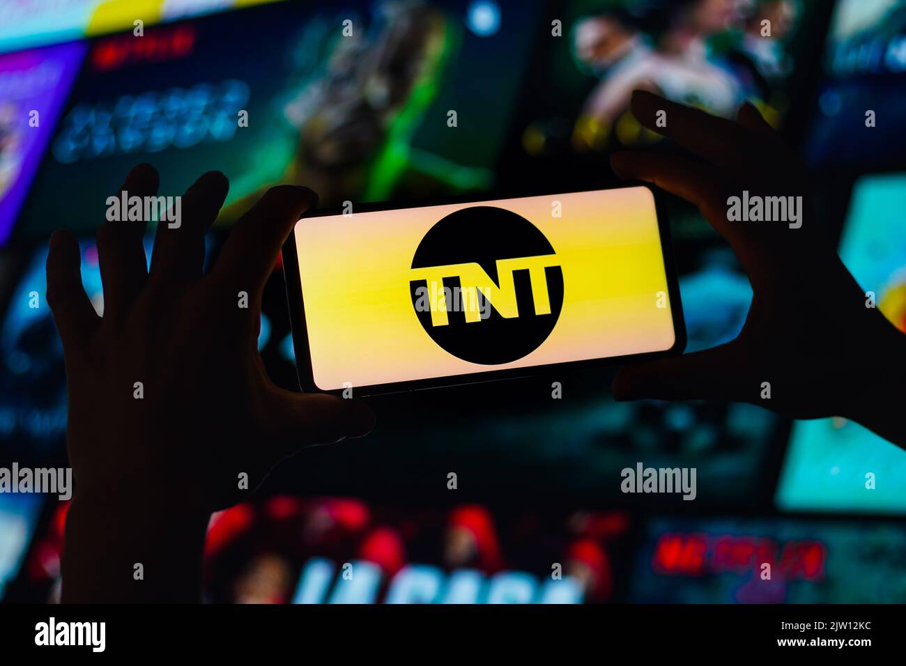 In this photo illustration, the Turner Network Television (TNT) logo is displayed on a smartphone screen. Stock Photo