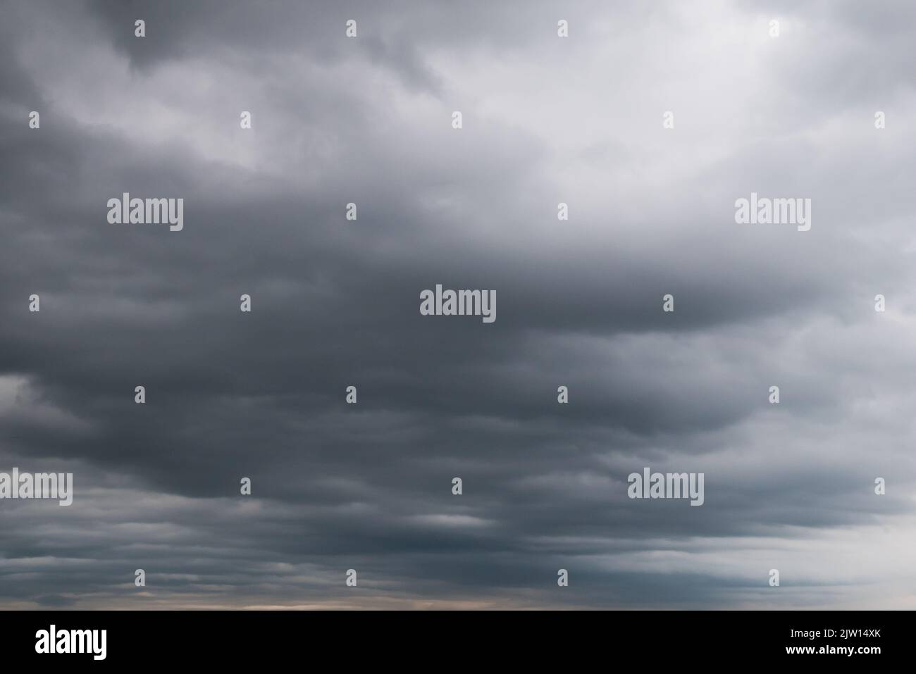 Grey sky background with white clouds Stock Photo