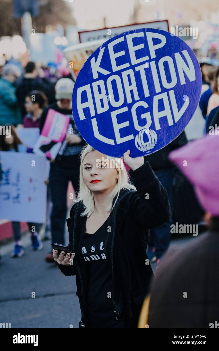 Women holding abortion signs in 2018 during womens march in Sacramento Stock Photo