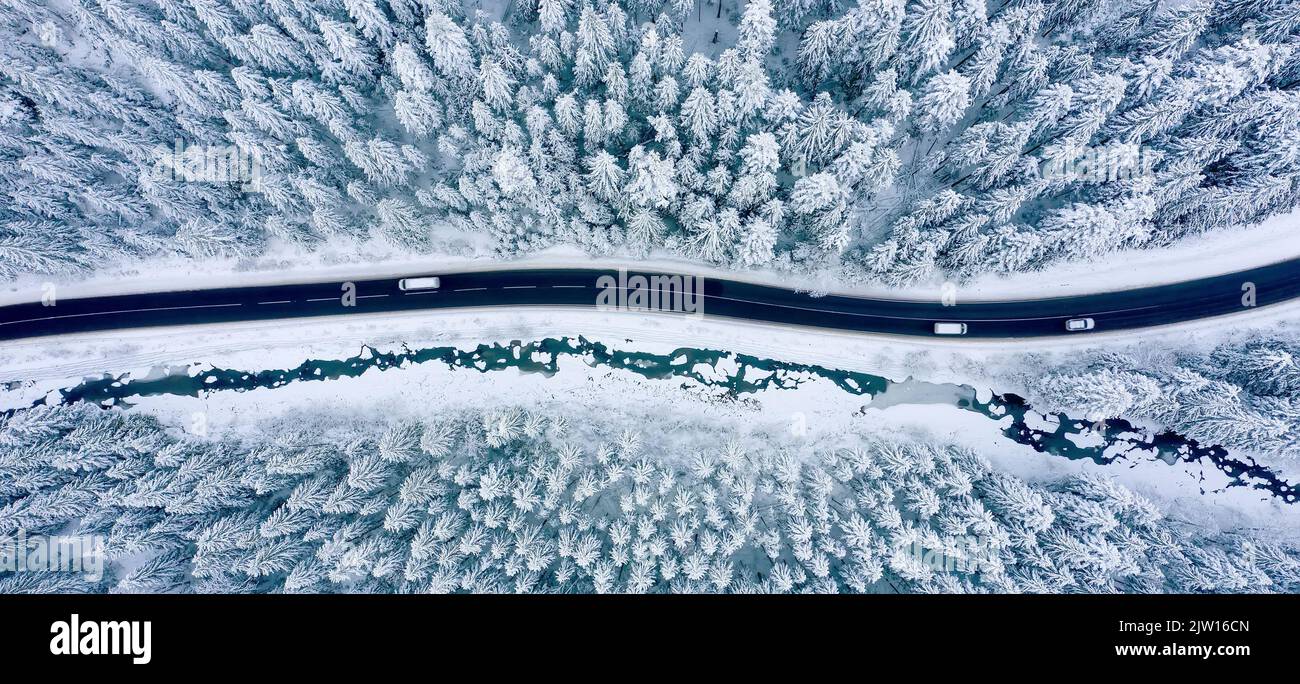Aerial view of winter road and snow-covered pine trees Stock Photo - Alamy