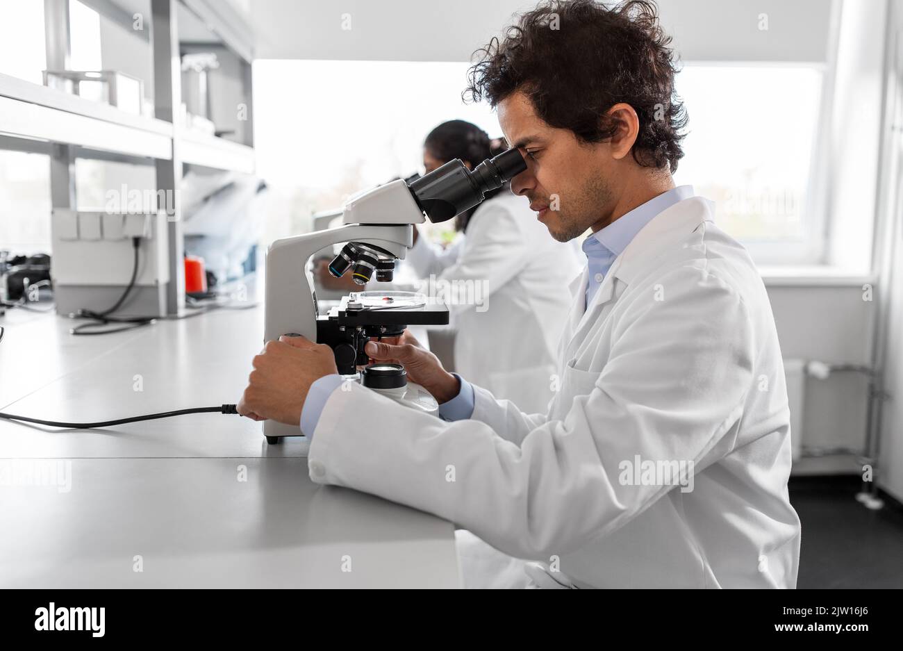 Hispanic man working scientist hi-res stock photography and images - Alamy